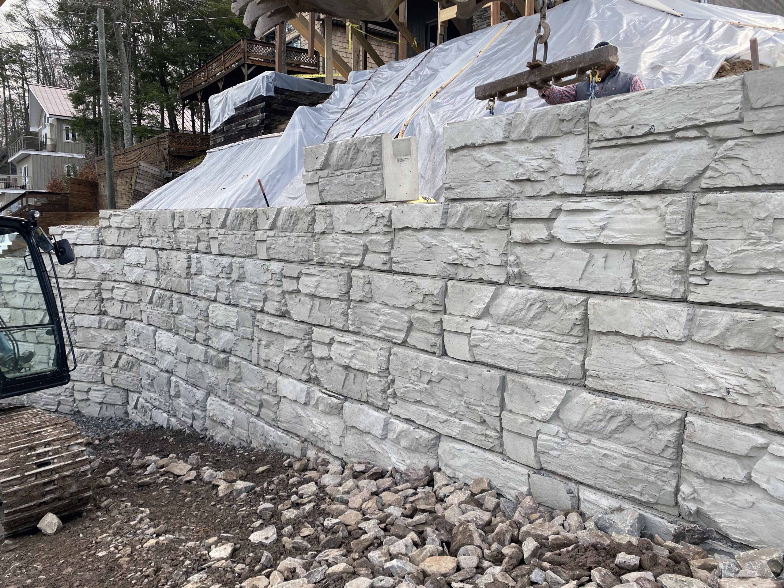 Installers build MagnumStone retaining wall