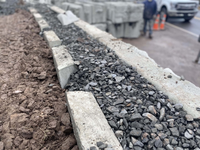 MagnumStone geogrid retaining wall with gravel for superior drainage