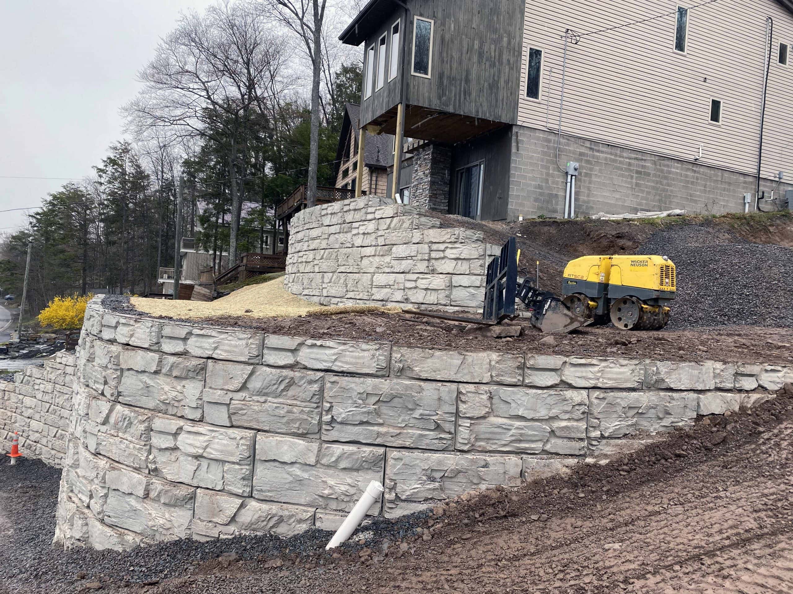 MagnumStone gravity retaining wall near foundation