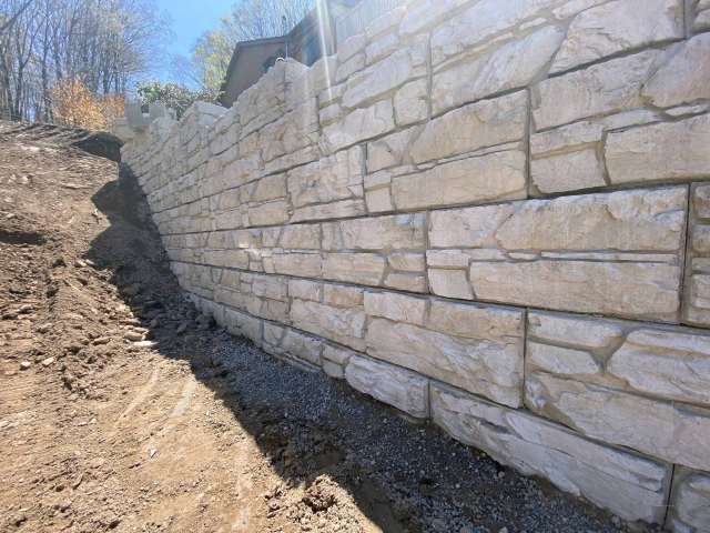 Tall MagnumStone gravity retaining wall