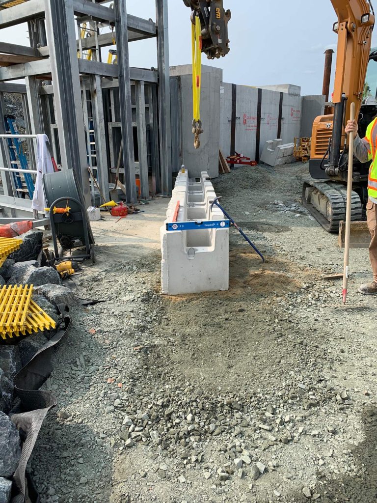 MagnumStone base units being installed on base levelling pad in a commercial application