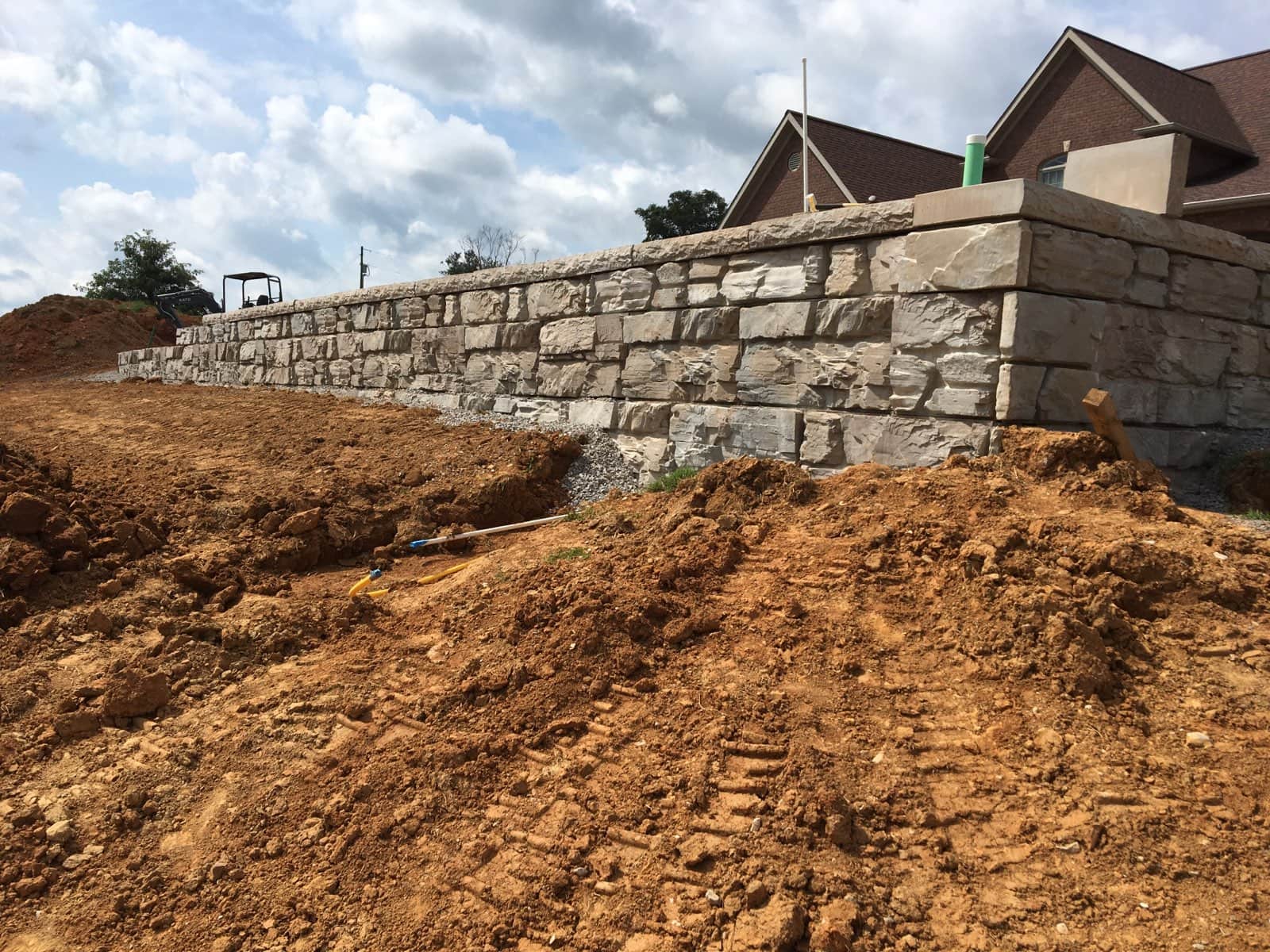 Installation of a Residential MagnumStone Ledge Face Retaining Wall In Kentucky