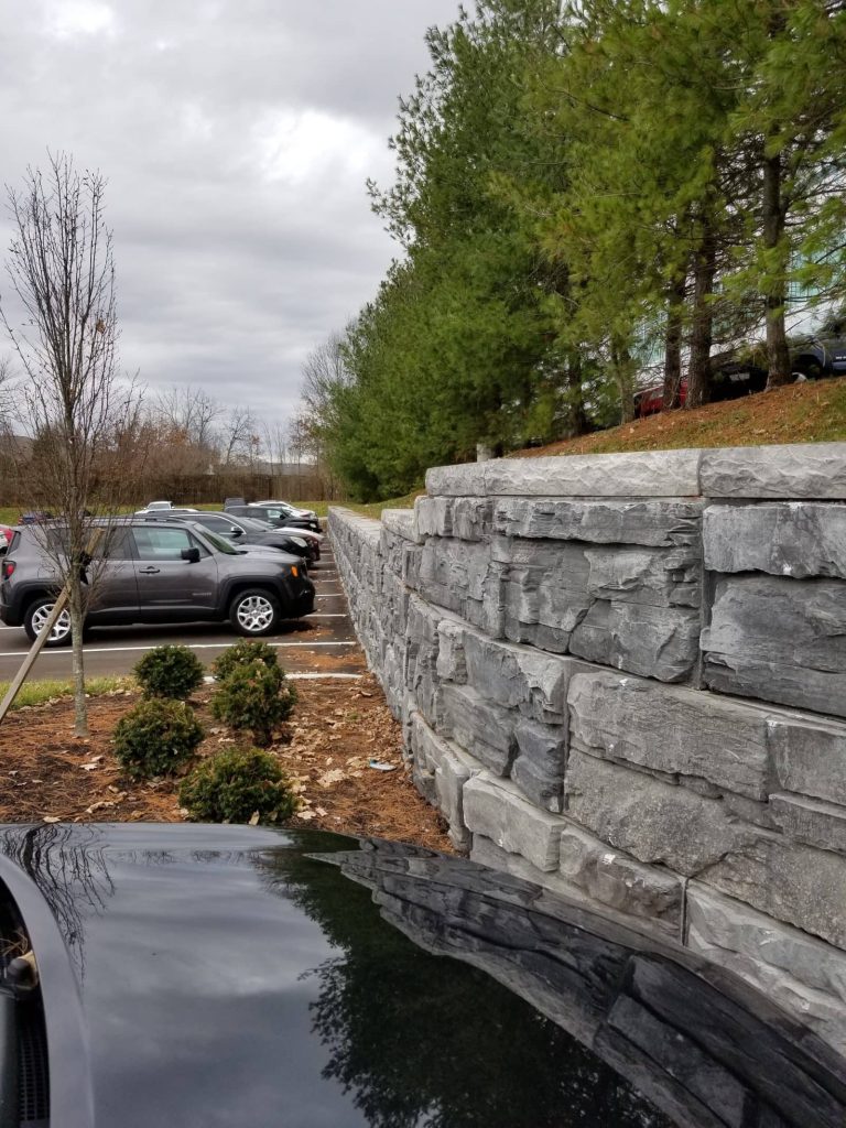 MagnumStone Retaining Wall used for parking lot extension in Lexington Kentucky. Features a curved wall finished with wall caps