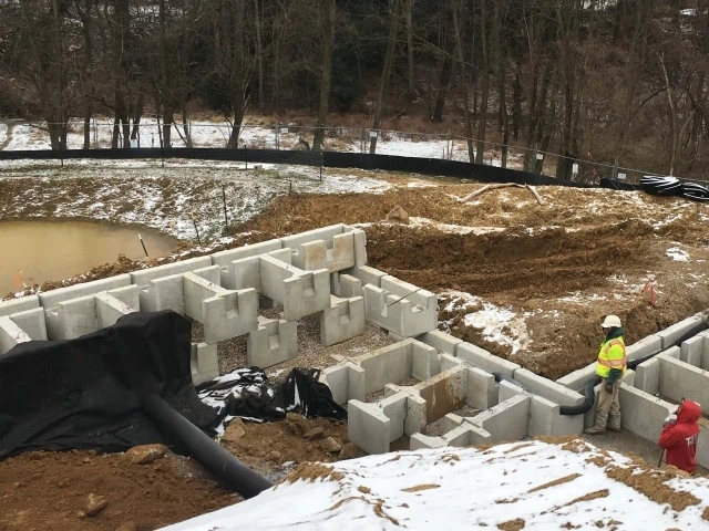 Gravity retaining wall extenders for outside corner MagnumStone wall