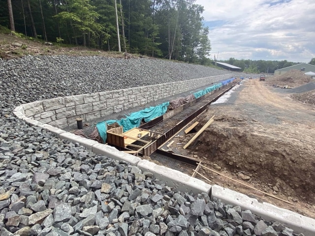 90-degree curve retaining wall for outdoor arena.