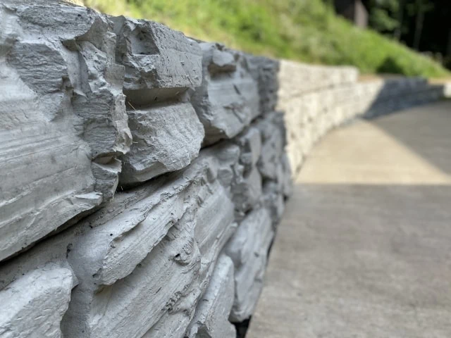 Deep-textured MagnumStone curved retaining walls.