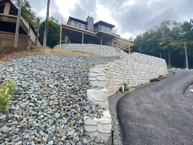 MagnumStone wall backfilled with crush gravel for excellent drainage.