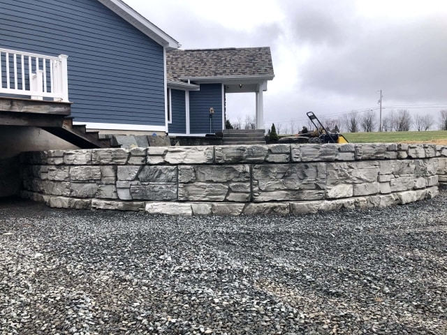 Unique curved yard retaining wall feature.