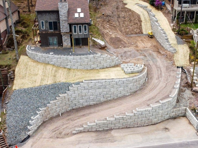 Aerial view of residential MagnumStone curved retaining wall project.
