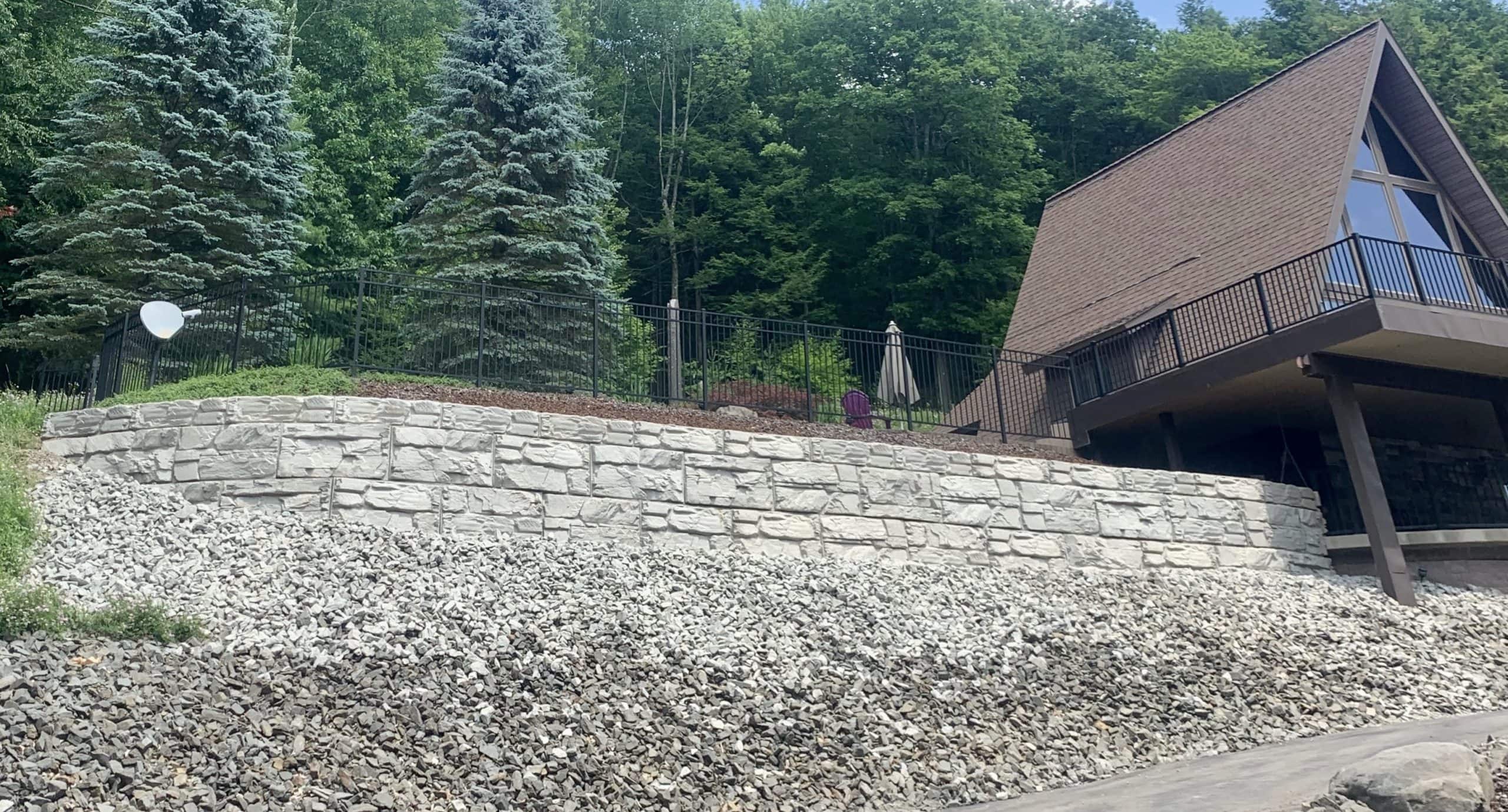 MagnumStone retaining wall replaces old failing wall for outdoor deck.