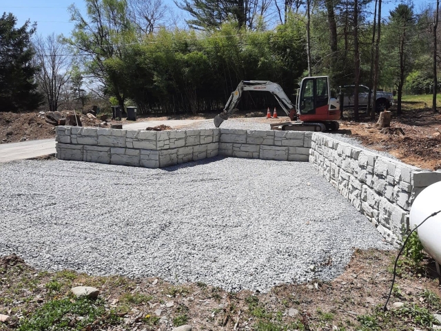 Parking area retaining walls built with MagnumStone blocks.