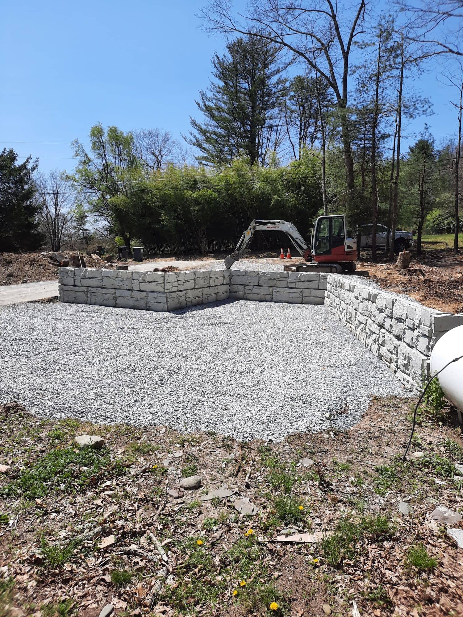 Parking area retaining walls built with MagnumStone blocks.