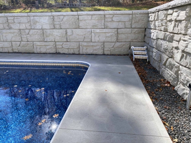 Poolside privacy retaining walls with MagnumStone gravity wall design.