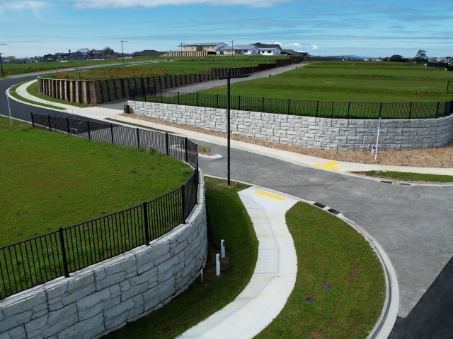 Fence posts in retaining wall by Cirtex, in NZ.