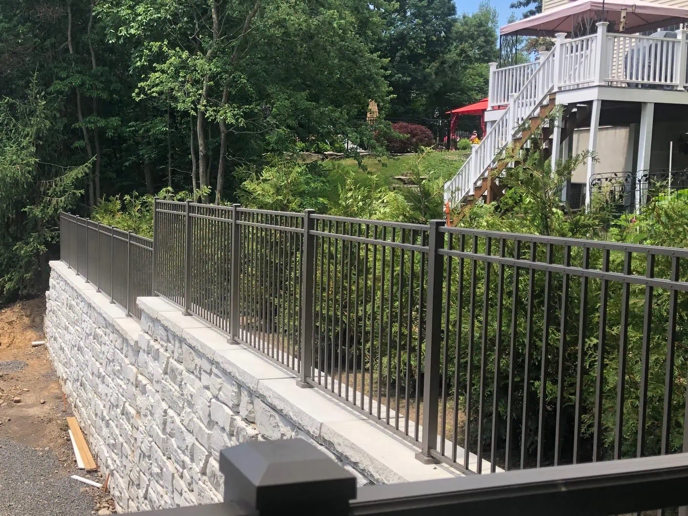 MagnumStone Fence Post Installation in Retaining Wall.