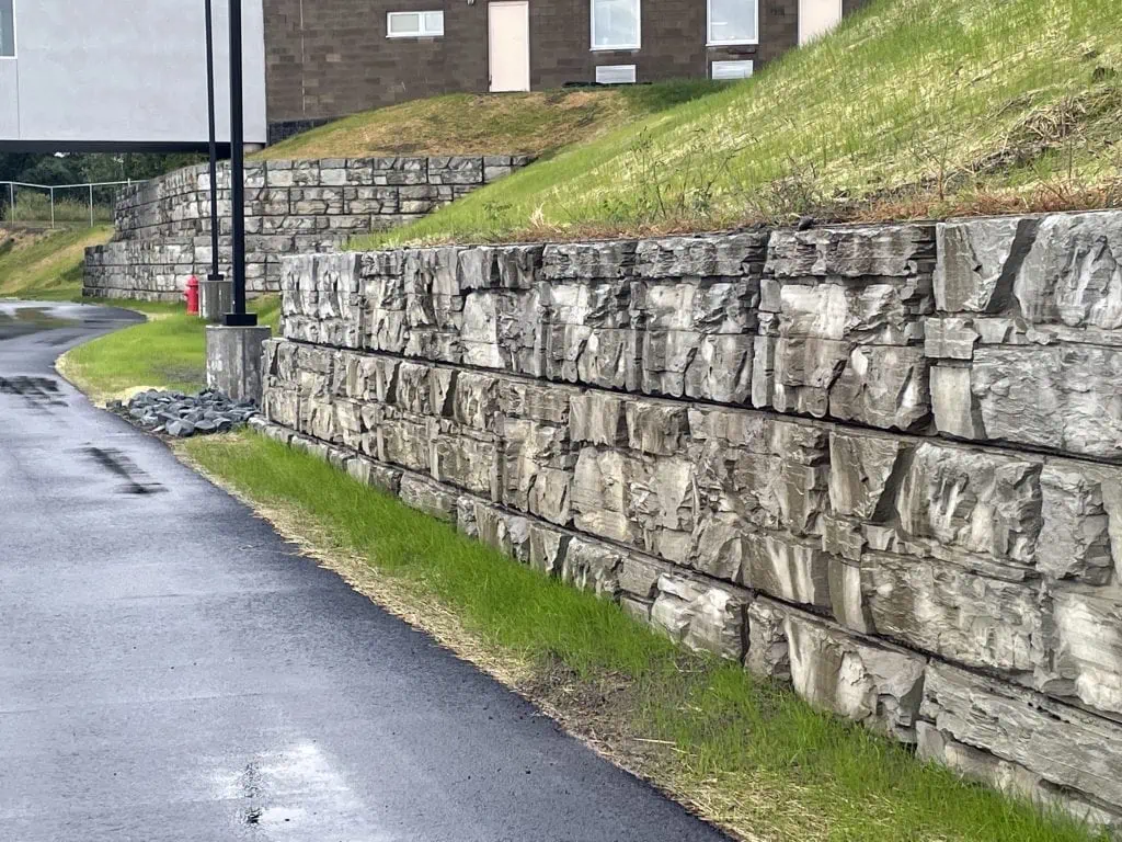 MagnumStone retaining wall blocks expand school property.