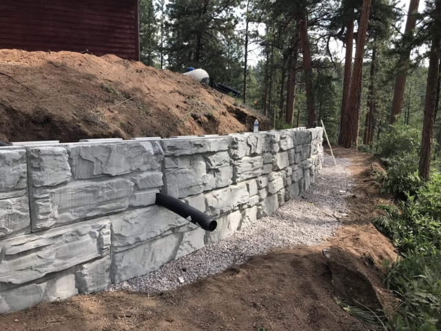 Installation of MagnumStone blocks and drainage.