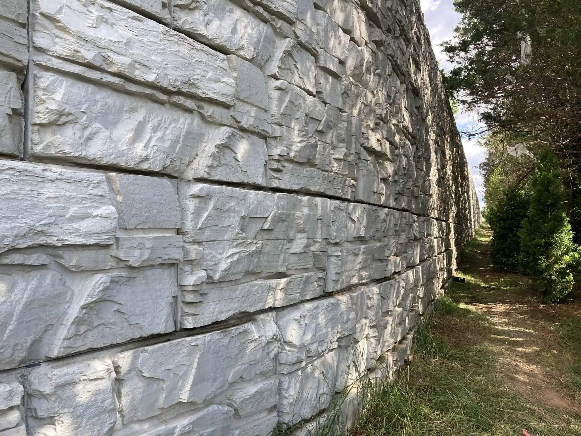 Long and tall MagnumStone retaining wall.