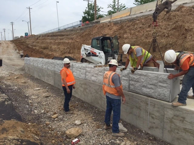 Building MagnumStone retaining wall for St. Louis Metro.