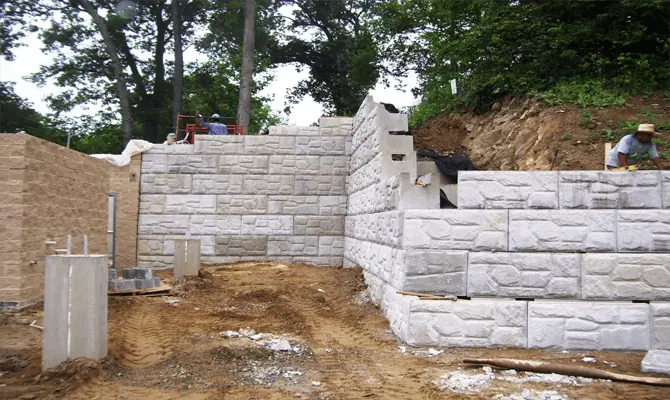 Construction of MagnumStone poolside retaining wall.