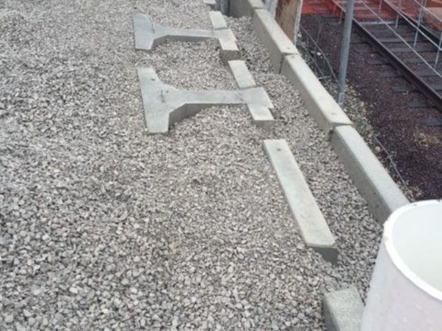 MagnumStone gravity extenders for St. Louis railroad retaining wall.