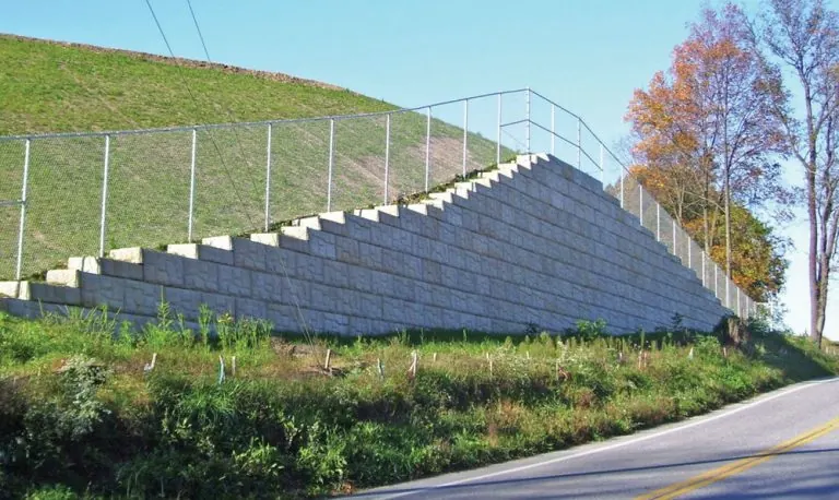 MagnumStone wall protects high school driveway.