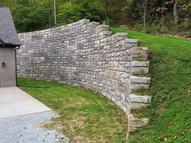 MagnumStone retaining wall stabilizes slope.