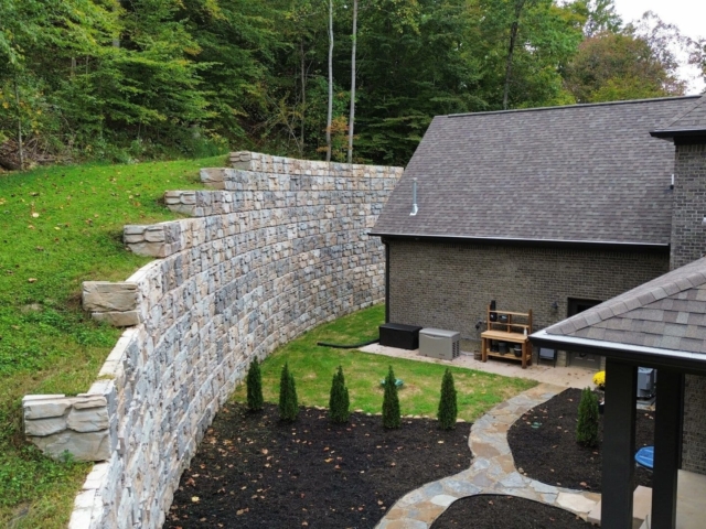 Residential MagnumStone retaining wall maximizes land use.