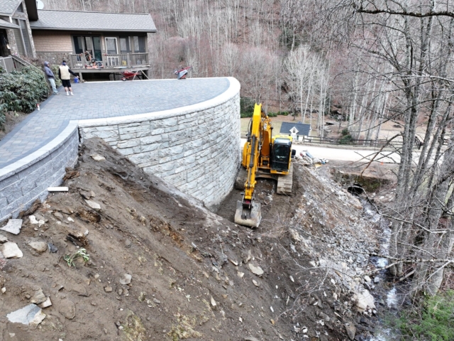 MagnumStone retaining wall saves home from collapse.