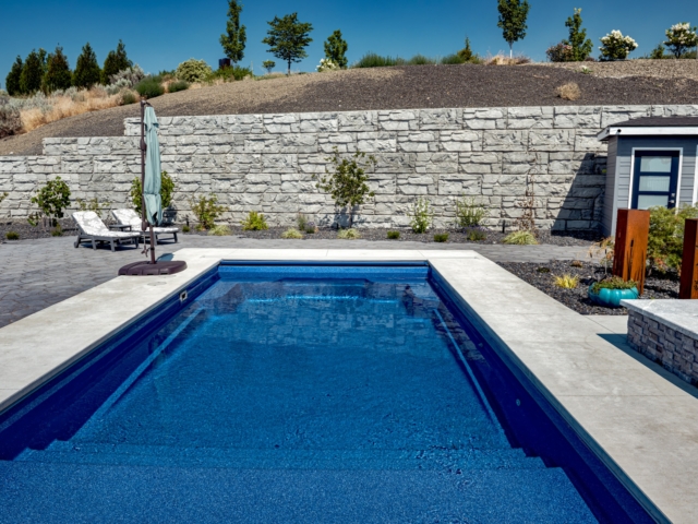 Gravity retaining wall makes space for pool. Gravity retaining wall makes space for pool.