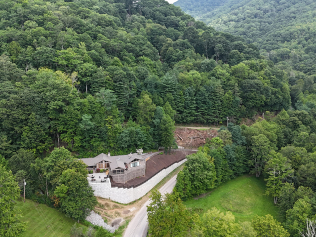 MagnumStone retaining wall protects hillside home.