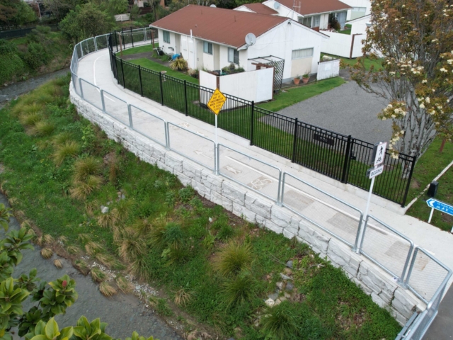 MagnumStone retaining wall protects residential community pathways. MagnumStone retaining wall protects residential community pathways.